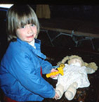 Young Ashley doctoring doll